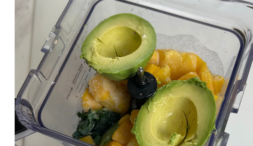 Healthy Kale and Avocado smoothie ingrediets in a blener