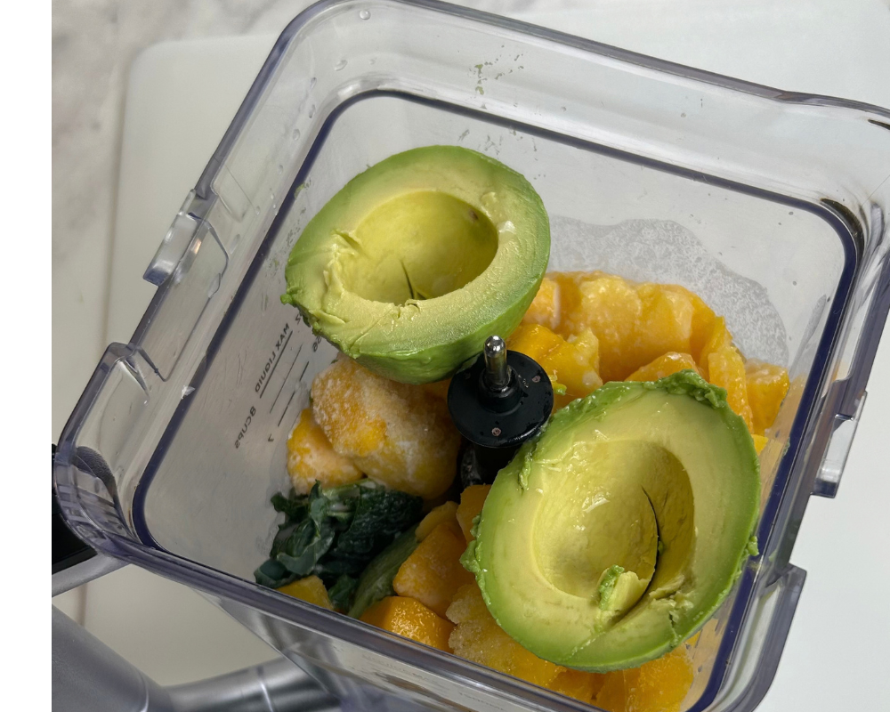 Healthy Kale and Avocado smoothie ingrediets in a blener