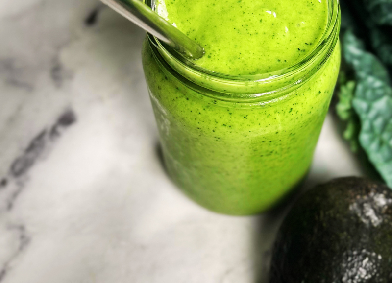 Healthy Kale and mango smoothie in a glass jar