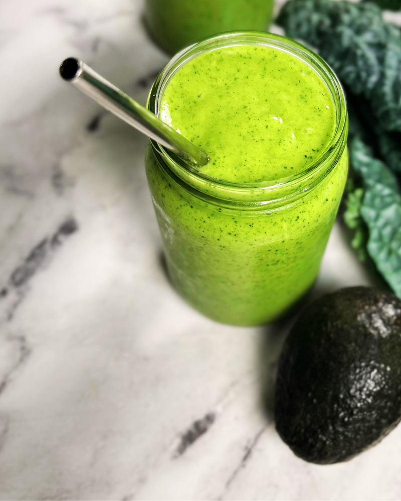 Healthy Kale and mango smoothie in a glass jar