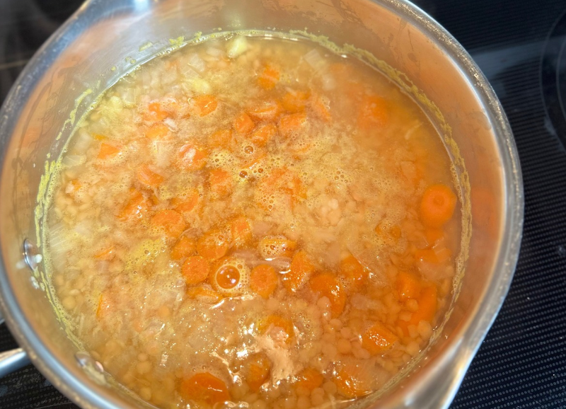 lentil and carrot soup in a pot